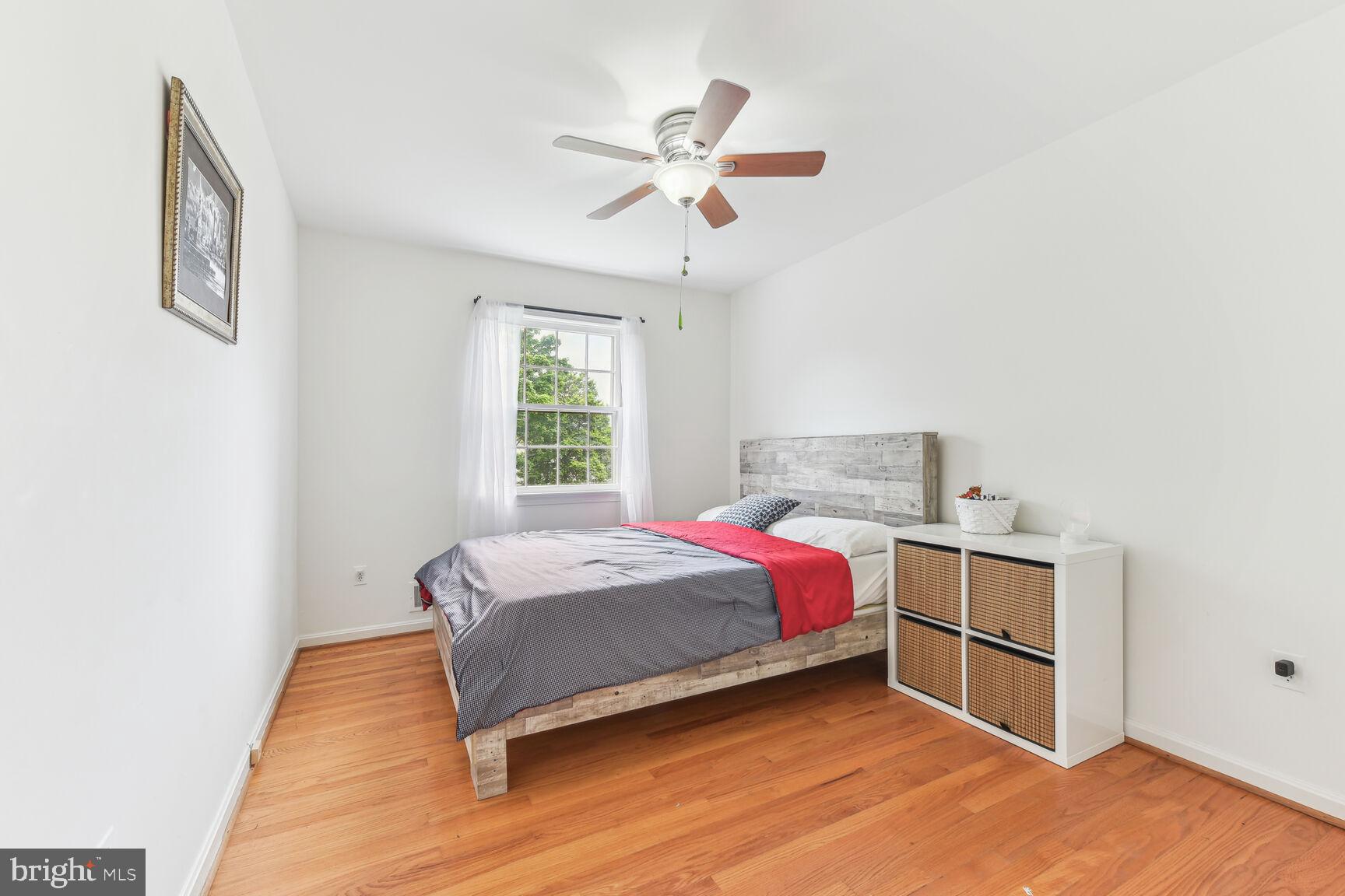 6719 Baron Road McLean, VA 22101 - Photo 18 of 30 a bed room with a bed and a ceiling fan