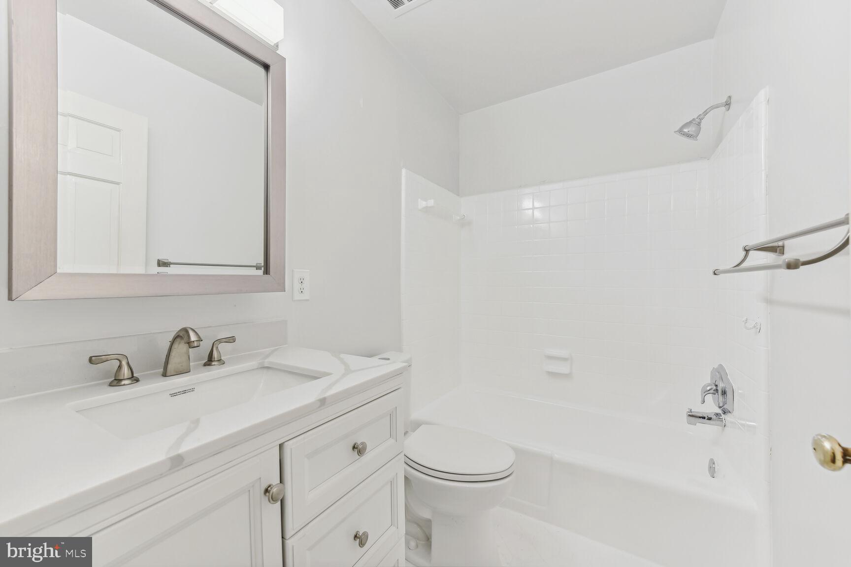 6719 Baron Road McLean, VA 22101 - Photo 19 of 30 a bathroom with a sink a toilet and shower