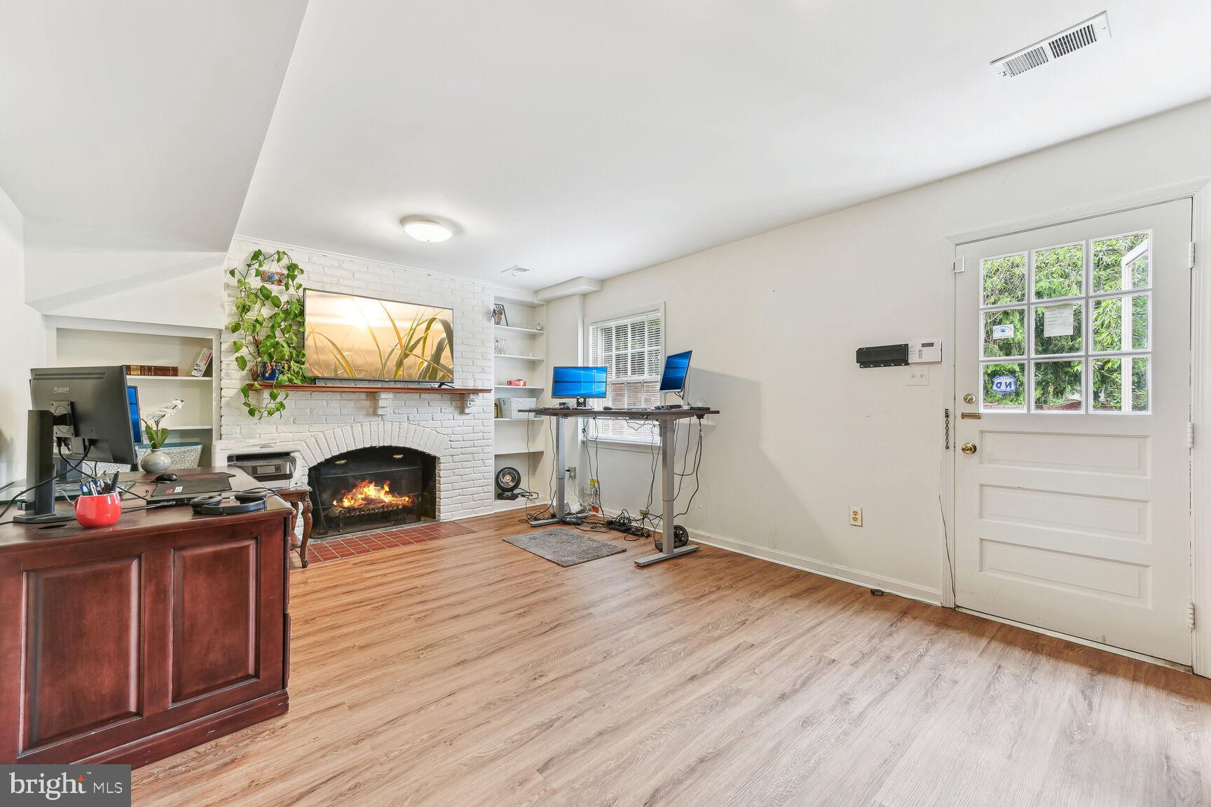 6719 Baron Road McLean, VA 22101 - Photo 22 of 30 a living room with furniture and a fireplace
