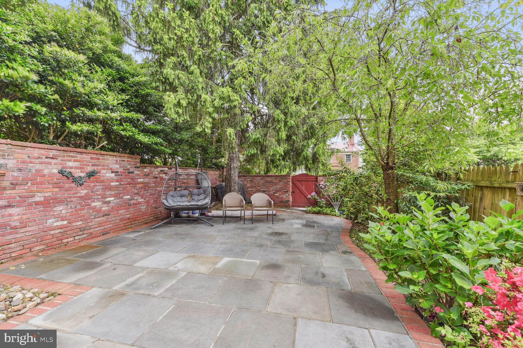 6719 Baron Road McLean, VA 22101 - Photo 24 of 30 a view of a backyard with chairs and a small yard