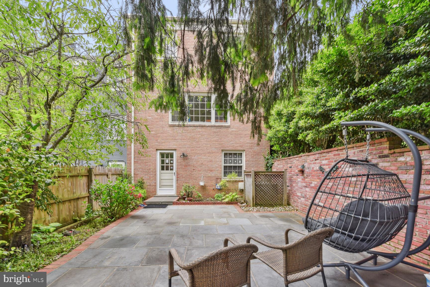 6719 Baron Road McLean, VA 22101 - Photo 25 of 30 a view of house with backyard and seating area