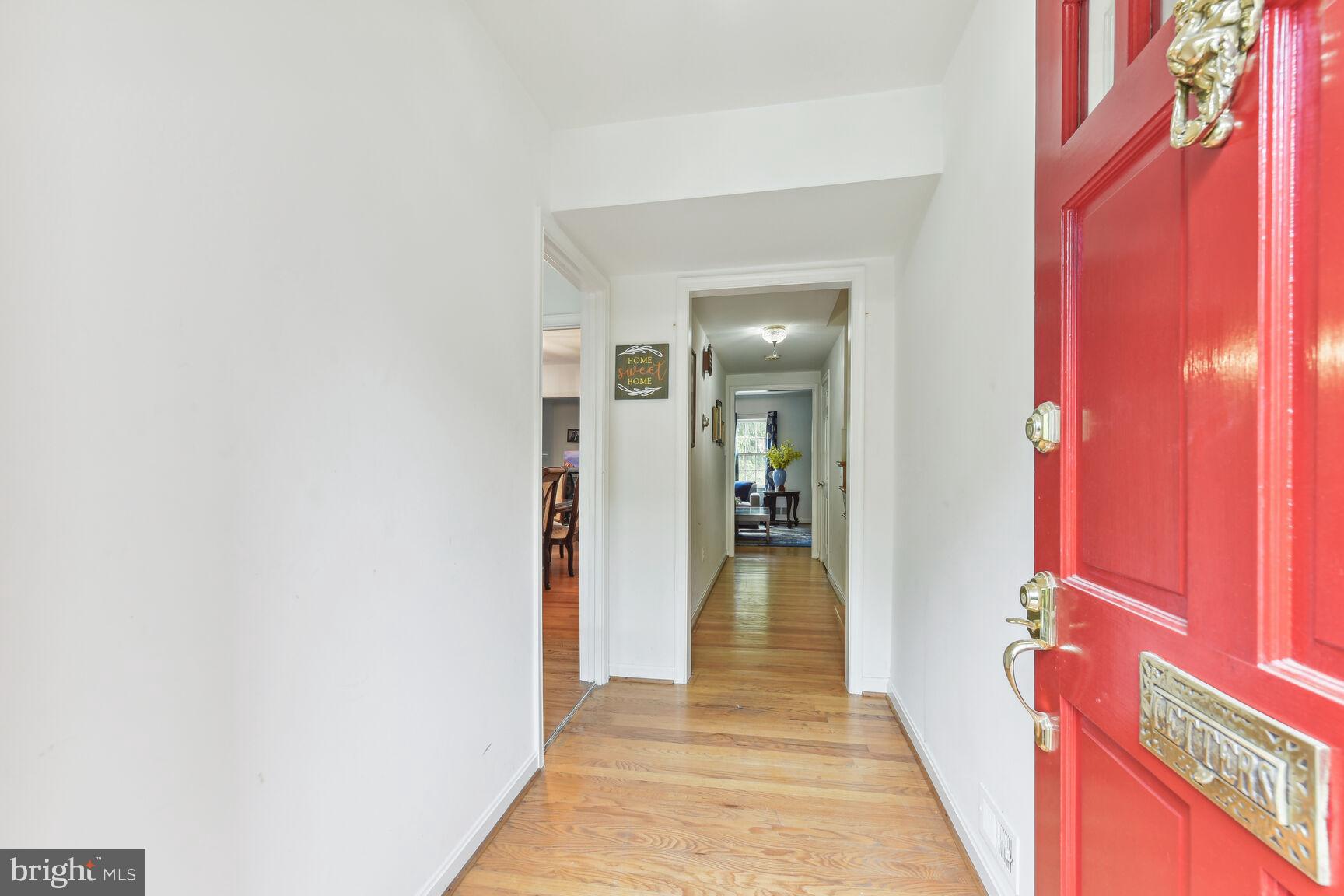 6719 Baron Road McLean, VA 22101 - Photo 4 of 30 a view of a hallway with wooden floor and staircase