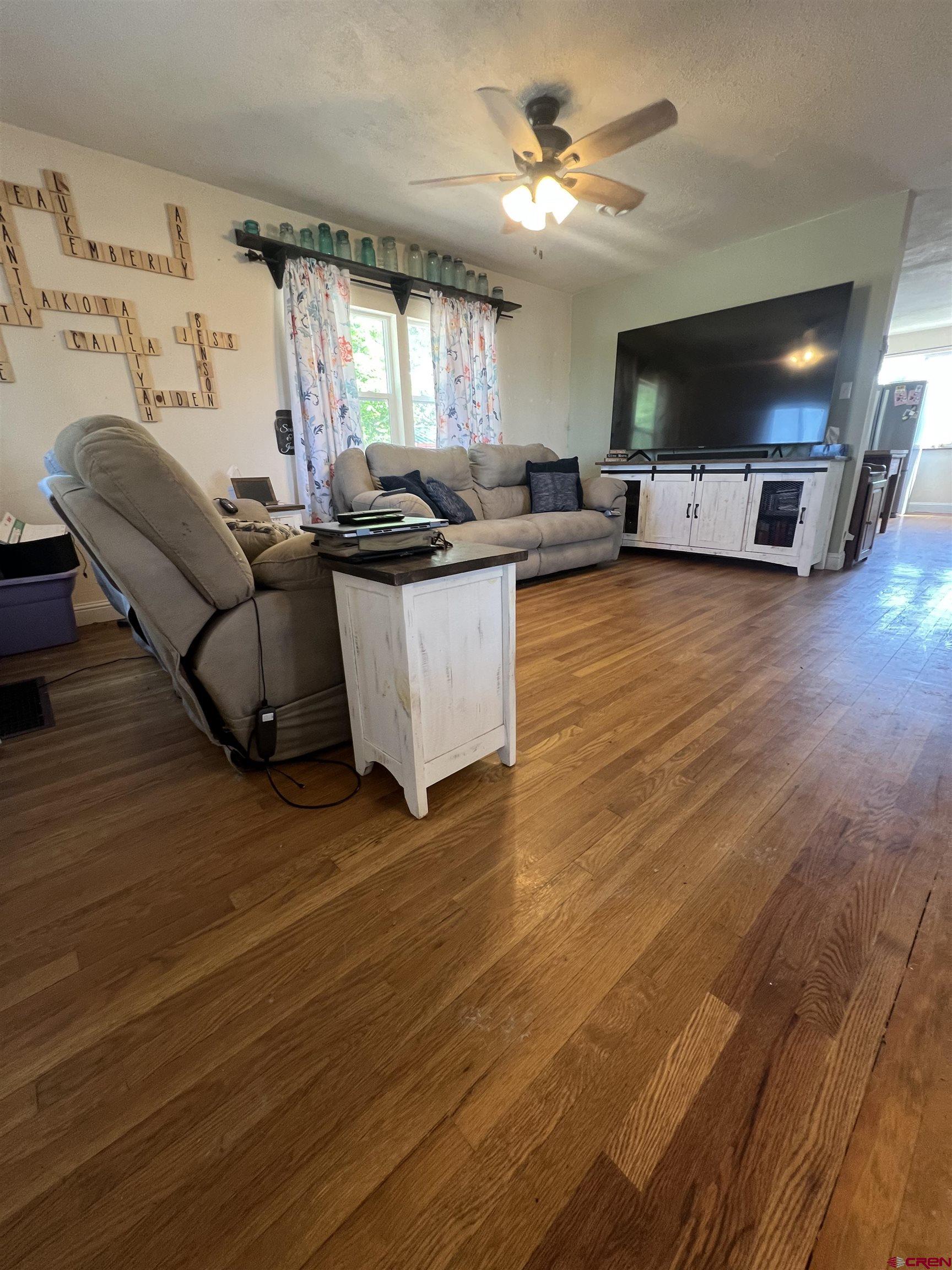 20691 Fairview Road Austin, CO 81410 - Photo 11 of 42 a living room with furniture and a wooden floor