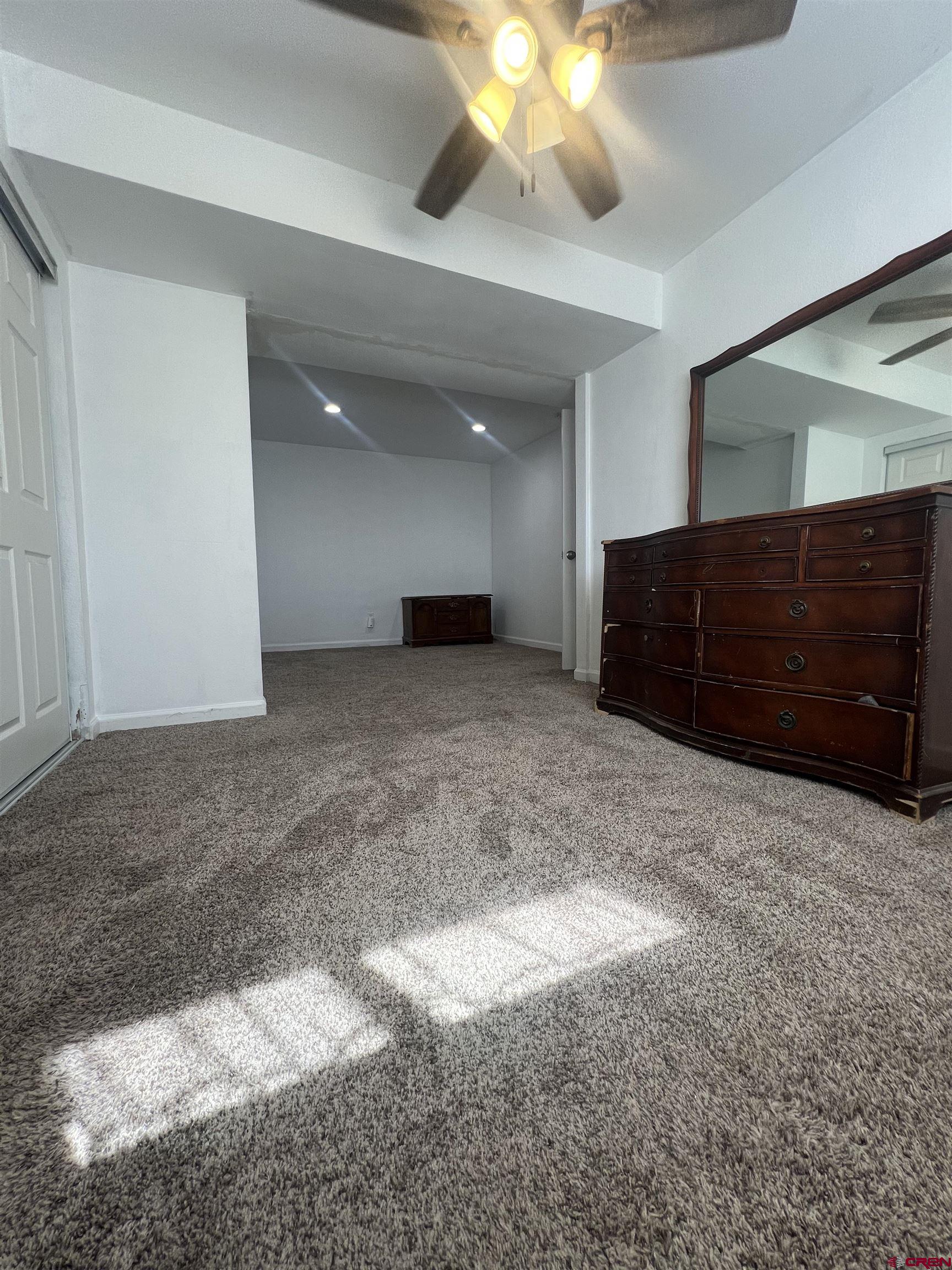 20691 Fairview Road Austin, CO 81410 - Photo 21 of 42 a view of a room with a cabinet and a chandelier fan