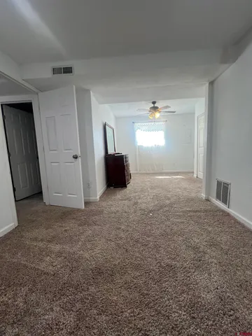 a view of an empty room and window