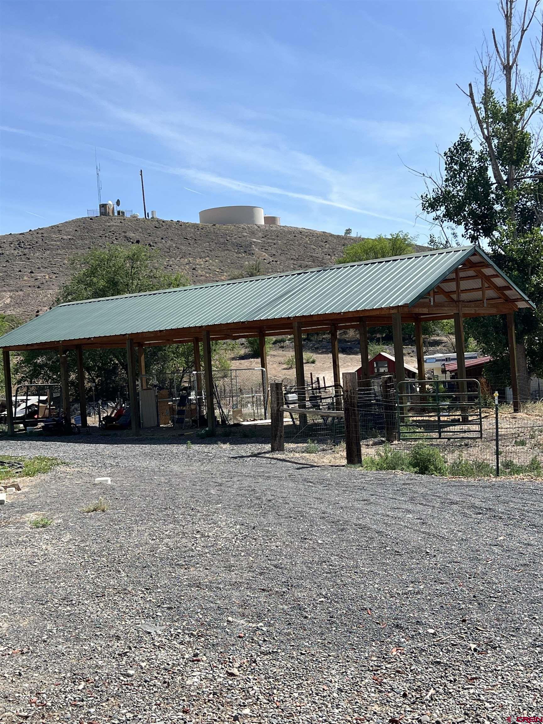 20691 Fairview Road Austin, CO 81410 - Photo 29 of 42 a backyard of a house with table and chairs