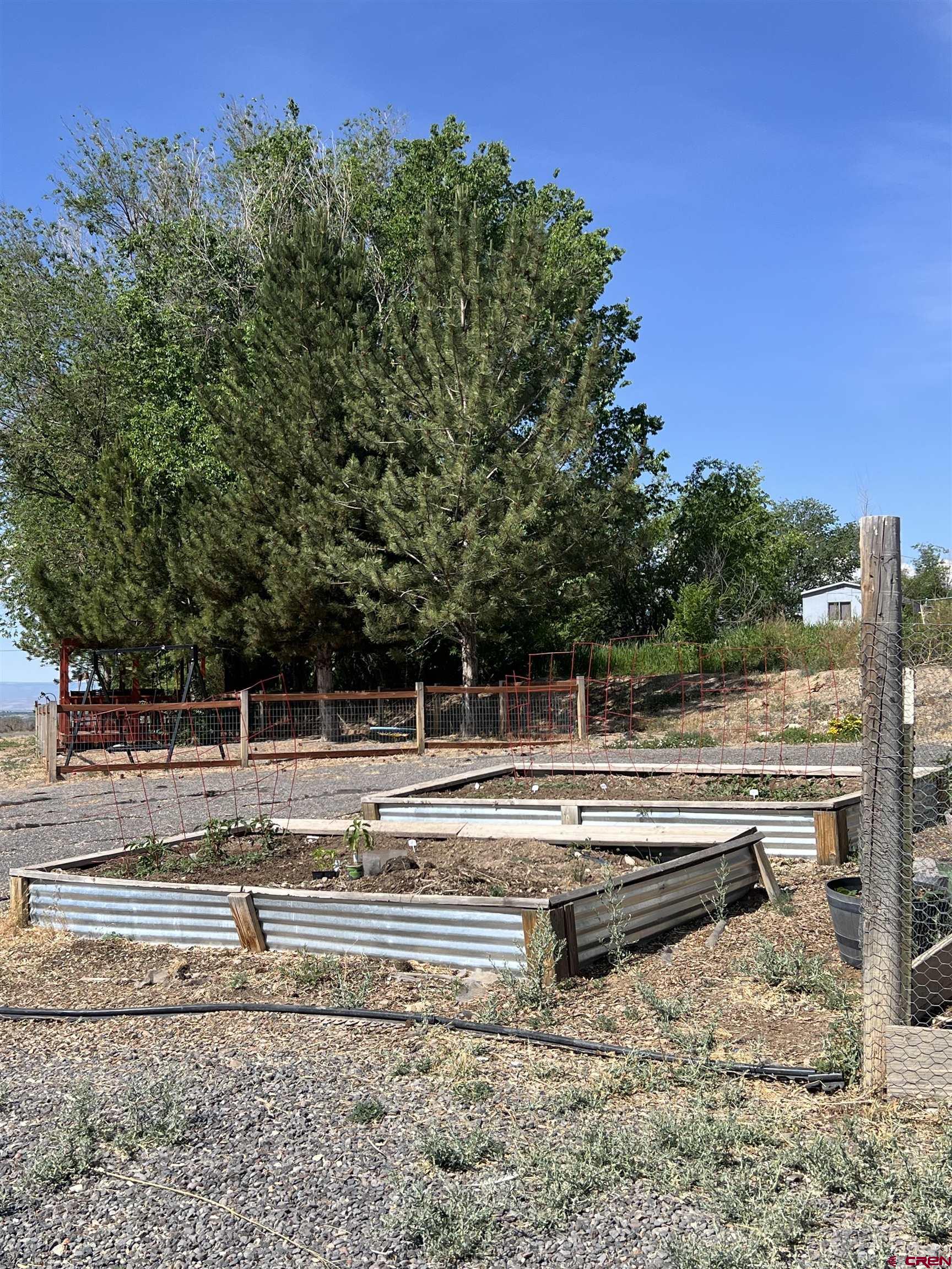 20691 Fairview Road Austin, CO 81410 - Photo 32 of 42 a view of a swimming pool with a yard