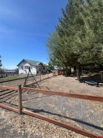 a view of a backyard of the house