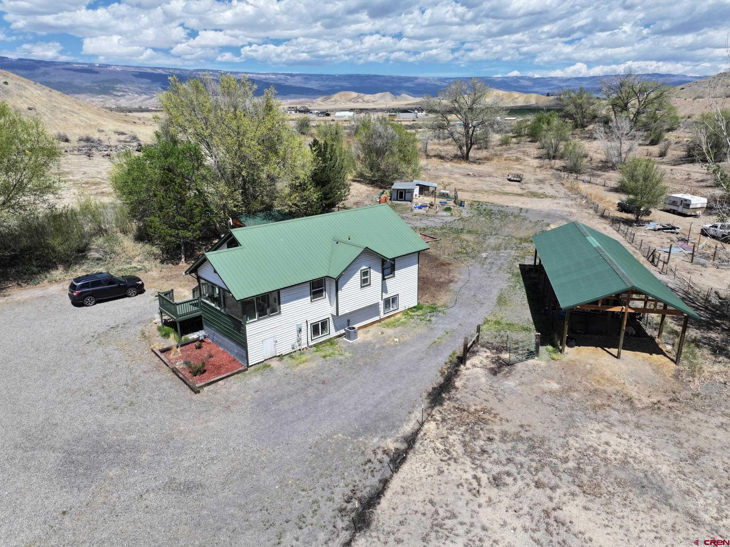 20691 Fairview Road Austin, CO 81410 - Photo 40 of 42 an aerial view of a house with garden space and street view