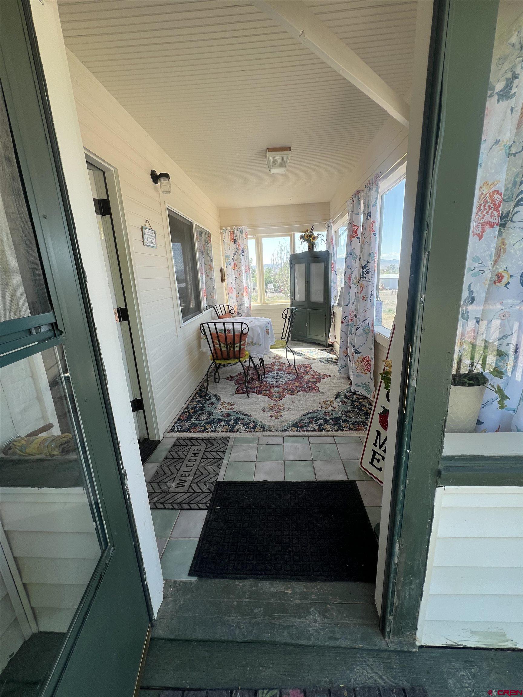20691 Fairview Road Austin, CO 81410 - Photo 4 of 42 a living room with furniture and a fireplace