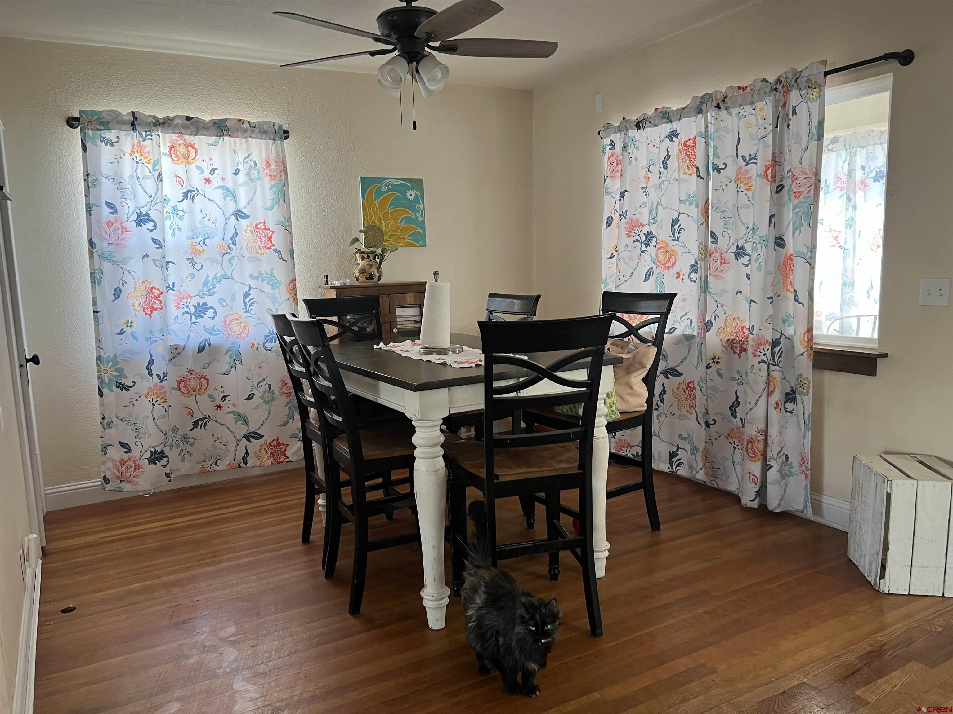 20691 Fairview Road Austin, CO 81410 - Photo 9 of 42 a view of a dining room with furniture and wooden floor