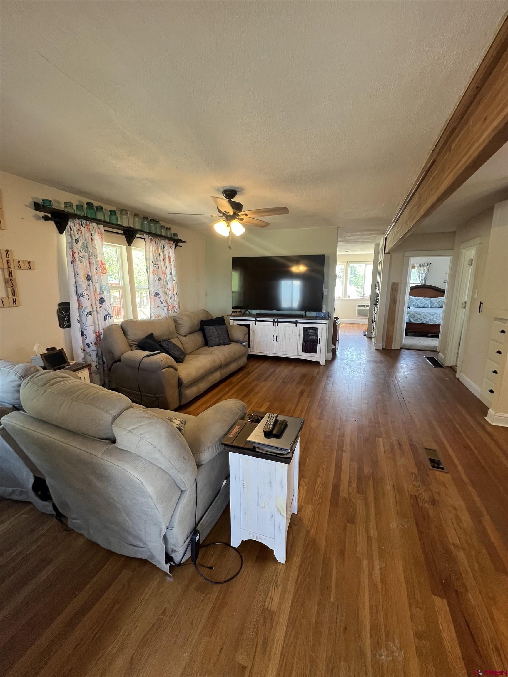 20691 Fairview Road Austin, CO 81410 - Photo 10 of 42 a living room with furniture and a wooden floor