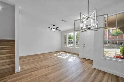 a view of empty room and wooden floor