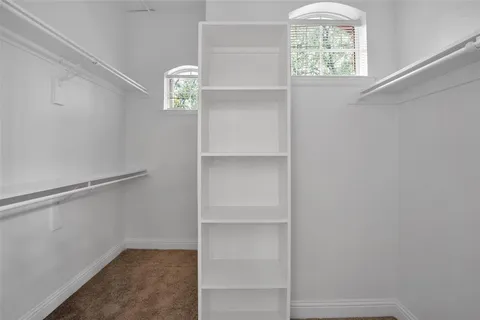 a view of walk in closet with window