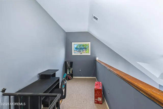 a bedroom with bed and a flat screen tv