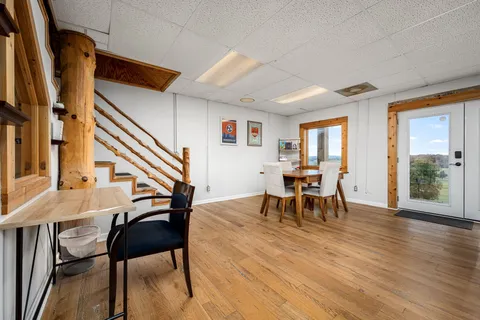 a view of a balcony with wooden floor