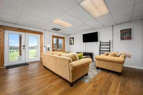 a view of a porch with wooden floor and iron stairs