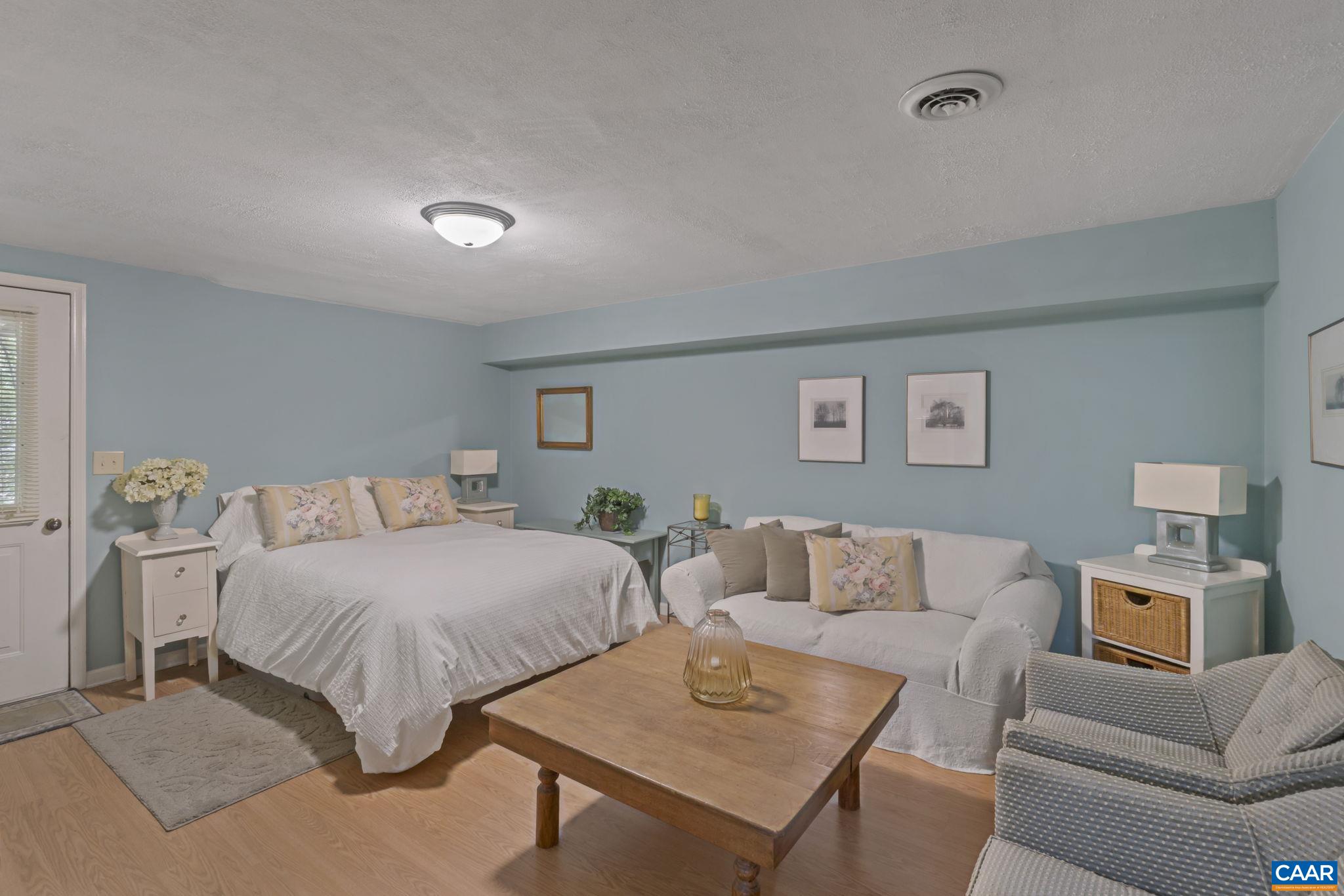 2 Whippoorwill Lane Palmyra, VA 22963 - Photo 24 of 36 a bedroom with a bed and a couch