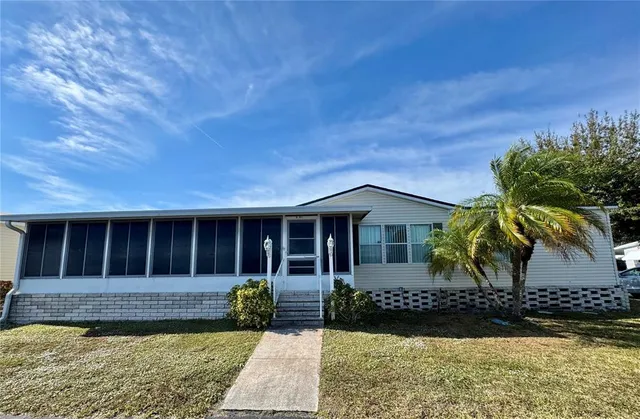 an aerial view of a house with a ocean view