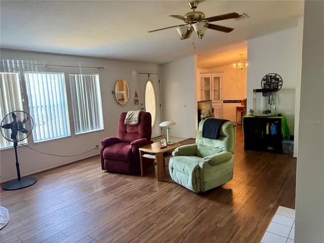 a bedroom with a bed and a television