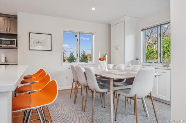a large kitchen with a table and chairs in it