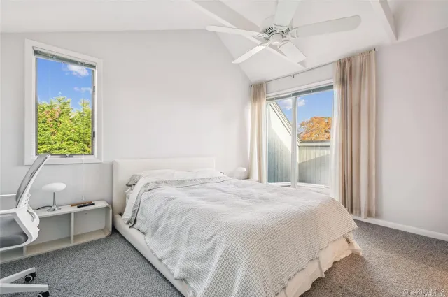 an aerial view of a house with a garden and a yard