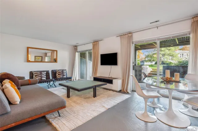 a bathroom with a sink mirror and toilet
