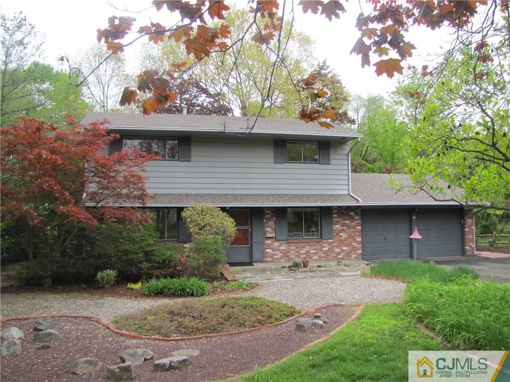 32 Raleigh Road Kendall Park, NJ 08824 - Photo 2 of 18 a front view of a house with a garden