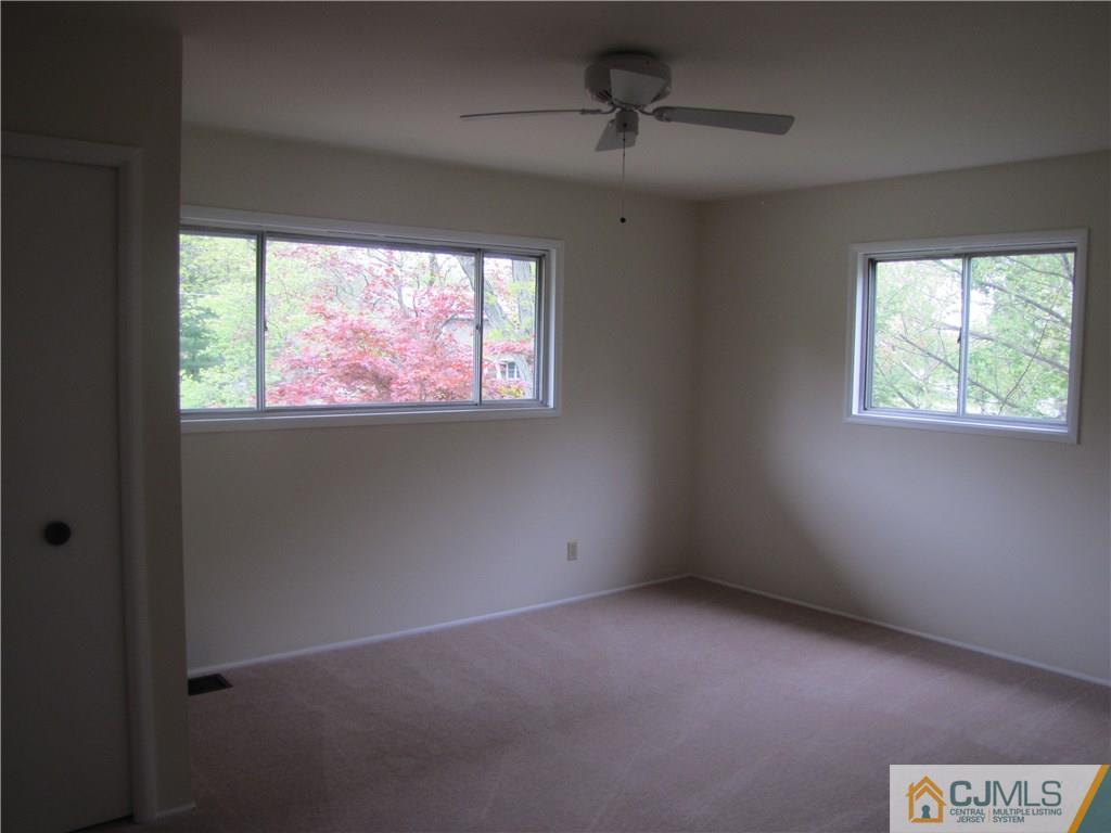 32 Raleigh Road Kendall Park, NJ 08824 - Photo 13 of 18 a view of an empty room with a window