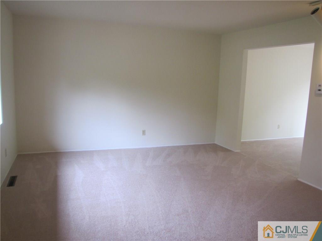 32 Raleigh Road Kendall Park, NJ 08824 - Photo 3 of 18 a view of an empty room