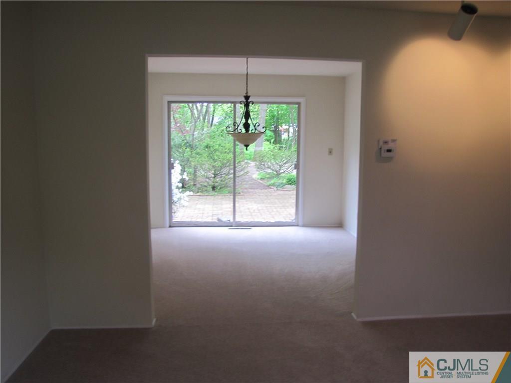 32 Raleigh Road Kendall Park, NJ 08824 - Photo 4 of 18 a view of a room that has a window in it