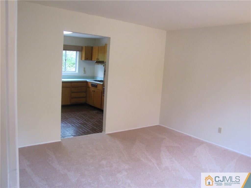 32 Raleigh Road Kendall Park, NJ 08824 - Photo 8 of 18 a view of an empty room and window