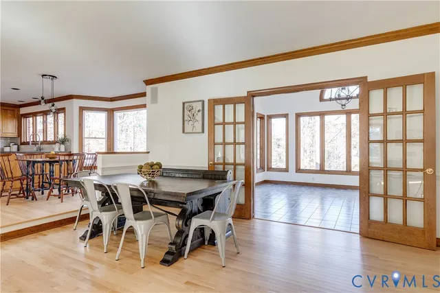 a view of an entryway with wooden floor
