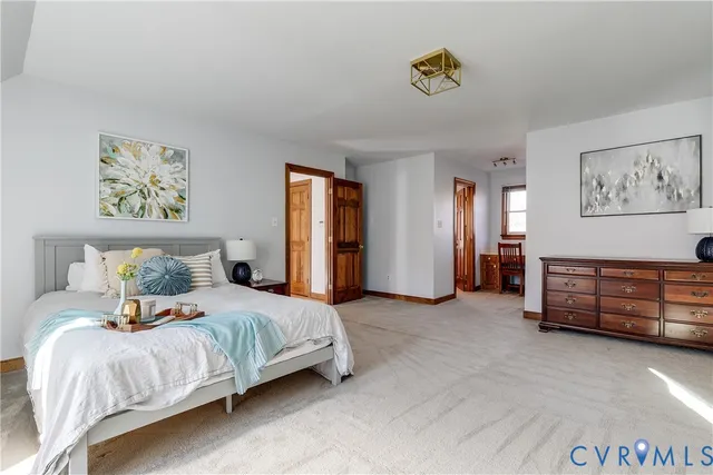 a bedroom with bed and window