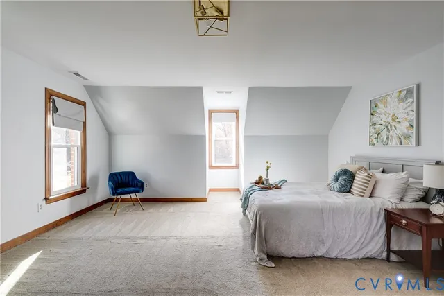 a reading room with furniture and a window