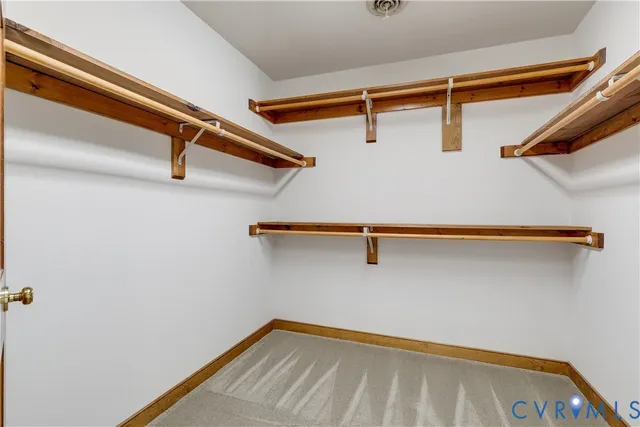 a spacious bathroom with a granite countertop sink mirror and bathtub