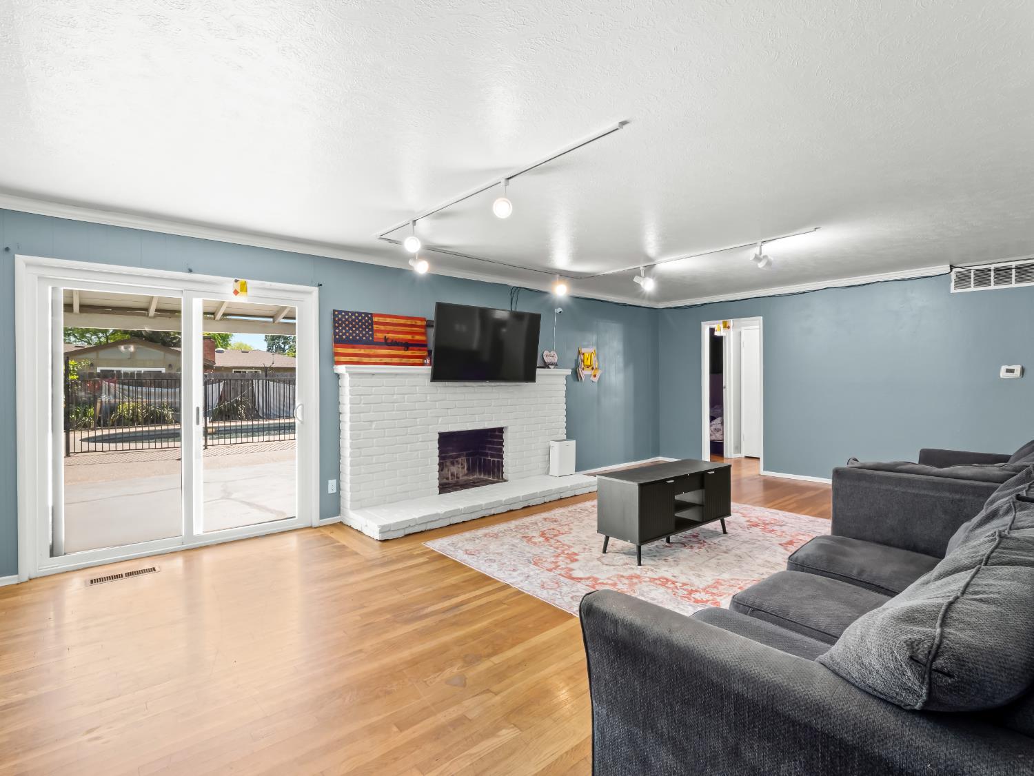519 West Rialto Avenue Fresno, CA 93705 - Photo 11 of 36 a living room with furniture and a fireplace