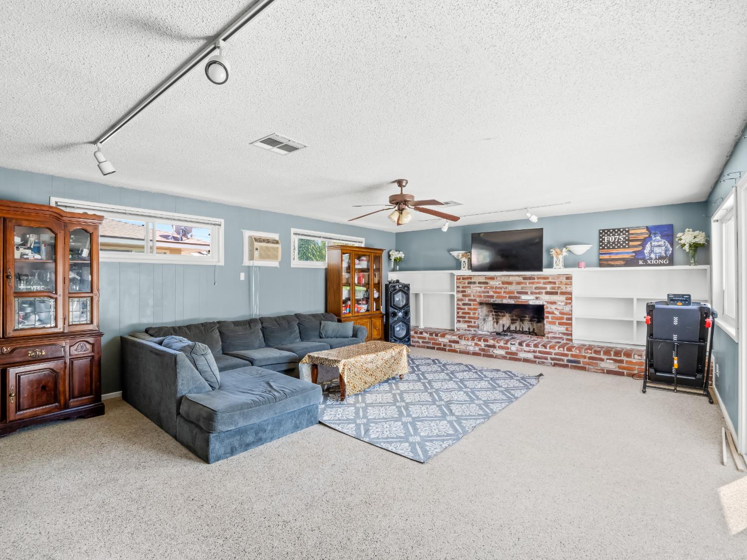 519 West Rialto Avenue Fresno, CA 93705 - Photo 16 of 36 a living room with furniture and a fireplace