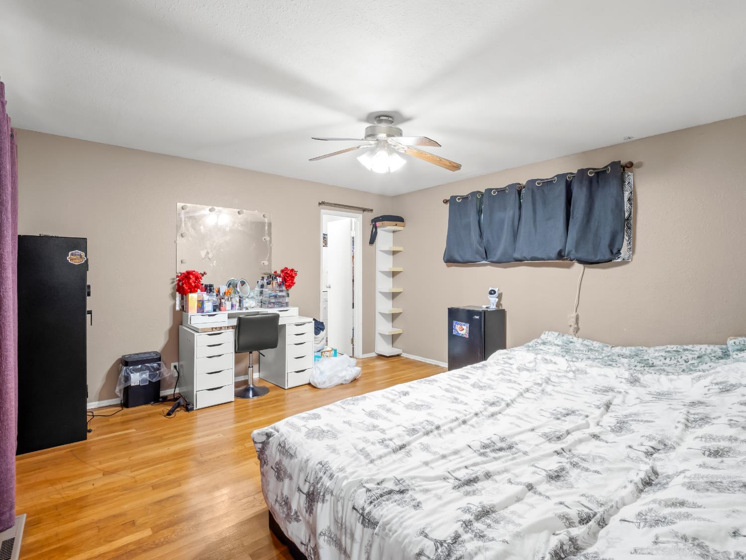 519 West Rialto Avenue Fresno, CA 93705 - Photo 23 of 36 a bed room with a bed mirror and a flat screen tv
