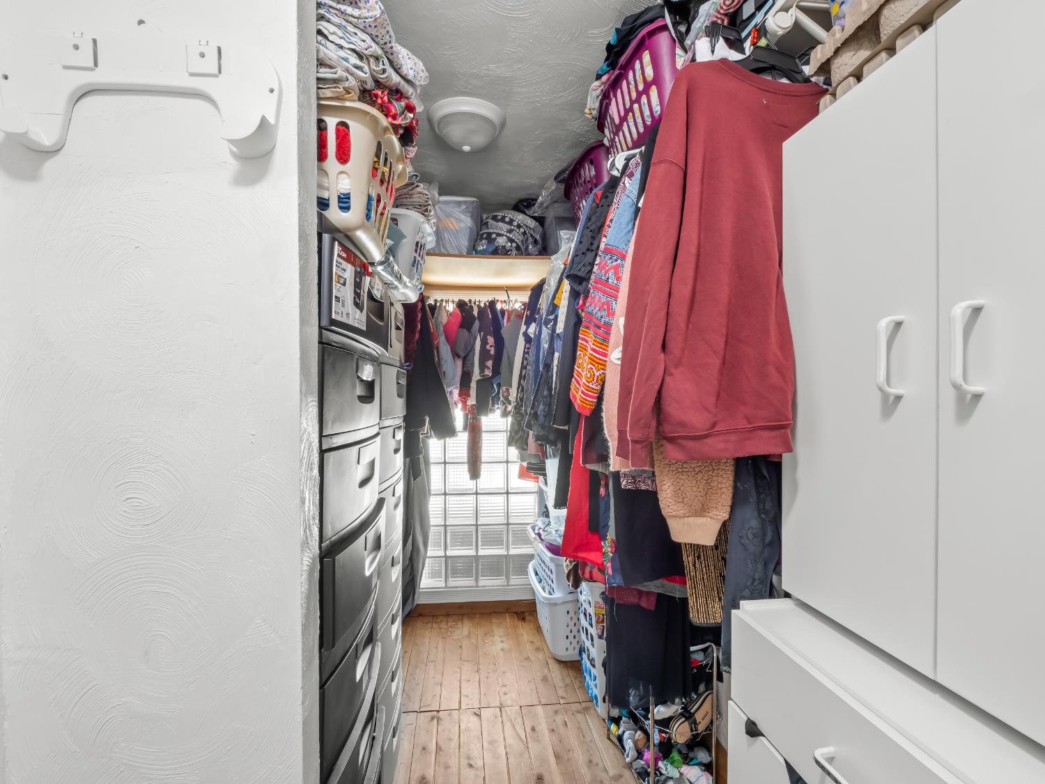 519 West Rialto Avenue Fresno, CA 93705 - Photo 25 of 36 a view of walk in closet with clothes and shoes