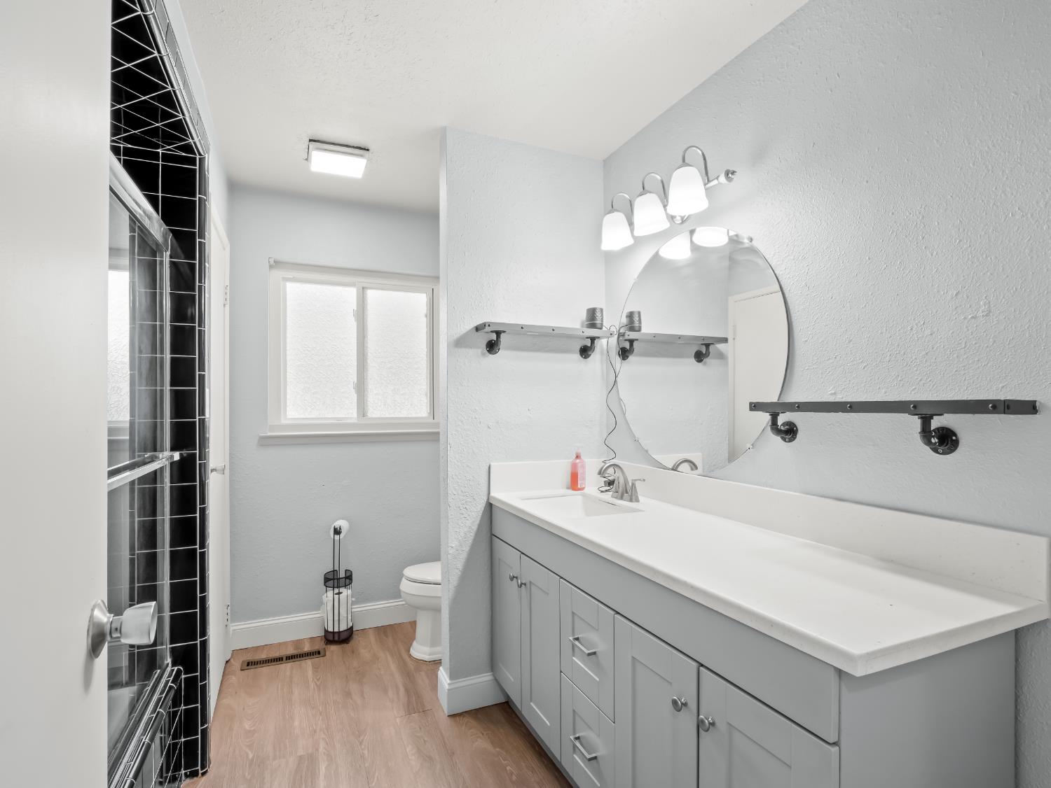 519 West Rialto Avenue Fresno, CA 93705 - Photo 26 of 36 a bathroom with a double vanity sink mirror and vanity