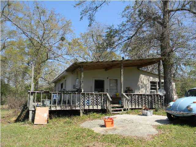 8346 Creston Barrow Road Baker, FL 32531 - Photo 12 of 13 a view of a house with roof deck