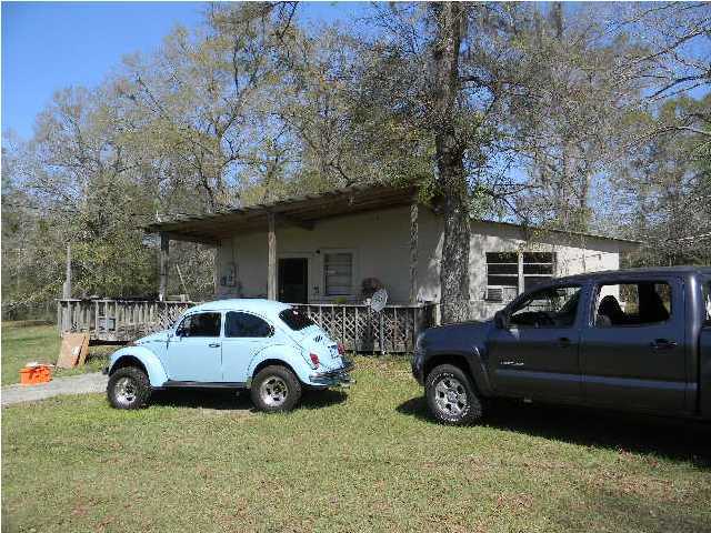 8346 Creston Barrow Road Baker, FL 32531 - Photo 13 of 13 a view of a car parked in front of a house