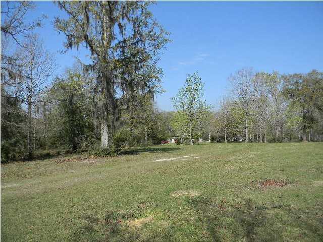 8346 Creston Barrow Road Baker, FL 32531 - Photo 6 of 13 a view of outdoor space with trees all around
