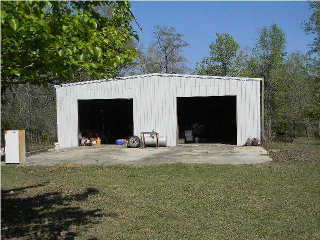 8346 Creston Barrow Road Baker, FL 32531 - Photo 8 of 13 a front view of a house with yard