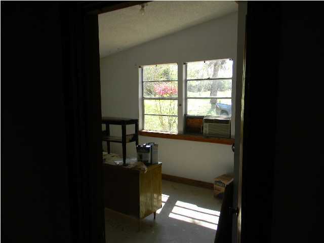 8346 Creston Barrow Road Baker, FL 32531 - Photo 10 of 13 a view of an empty room with a window