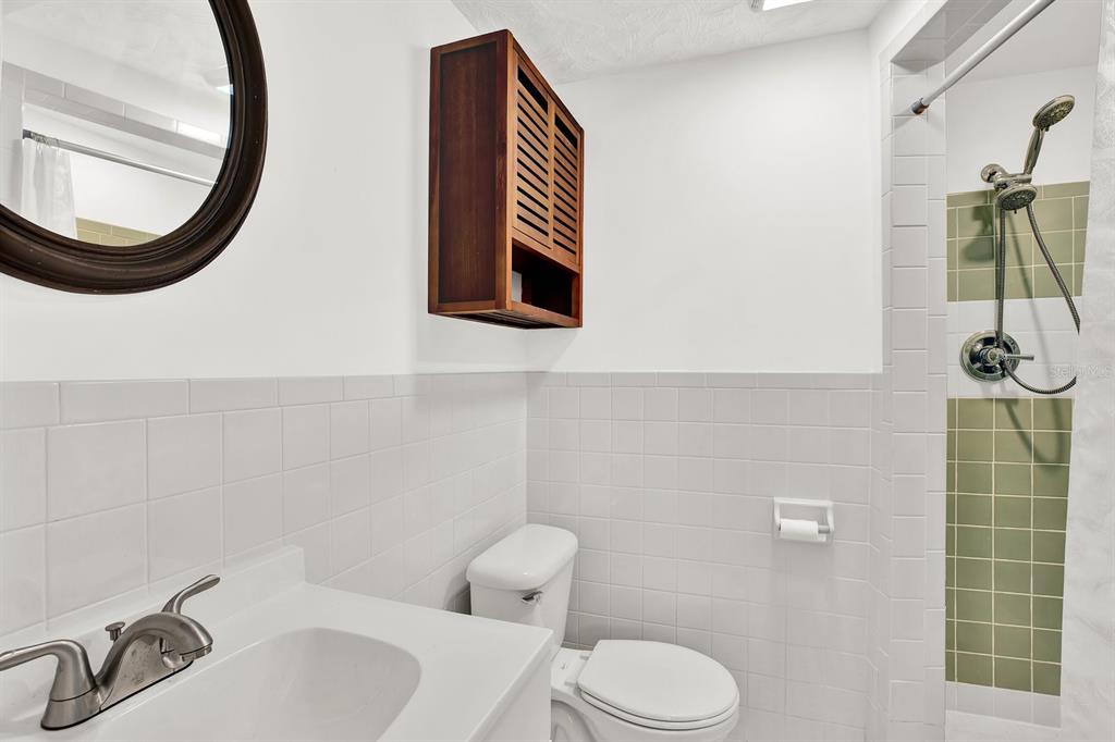 13739 Lavender Avenue Hudson, FL 34667 - Photo 15 of 25 a bathroom with a sink a toilet and a mirror