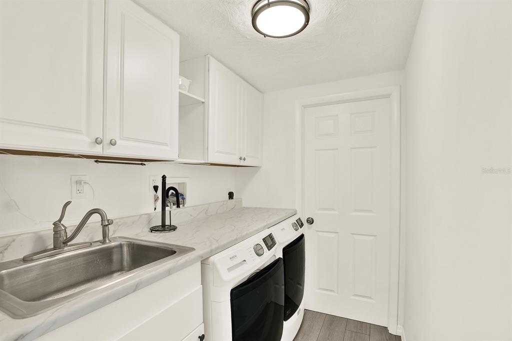 13739 Lavender Avenue Hudson, FL 34667 - Photo 16 of 25 a kitchen with a sink and cabinets