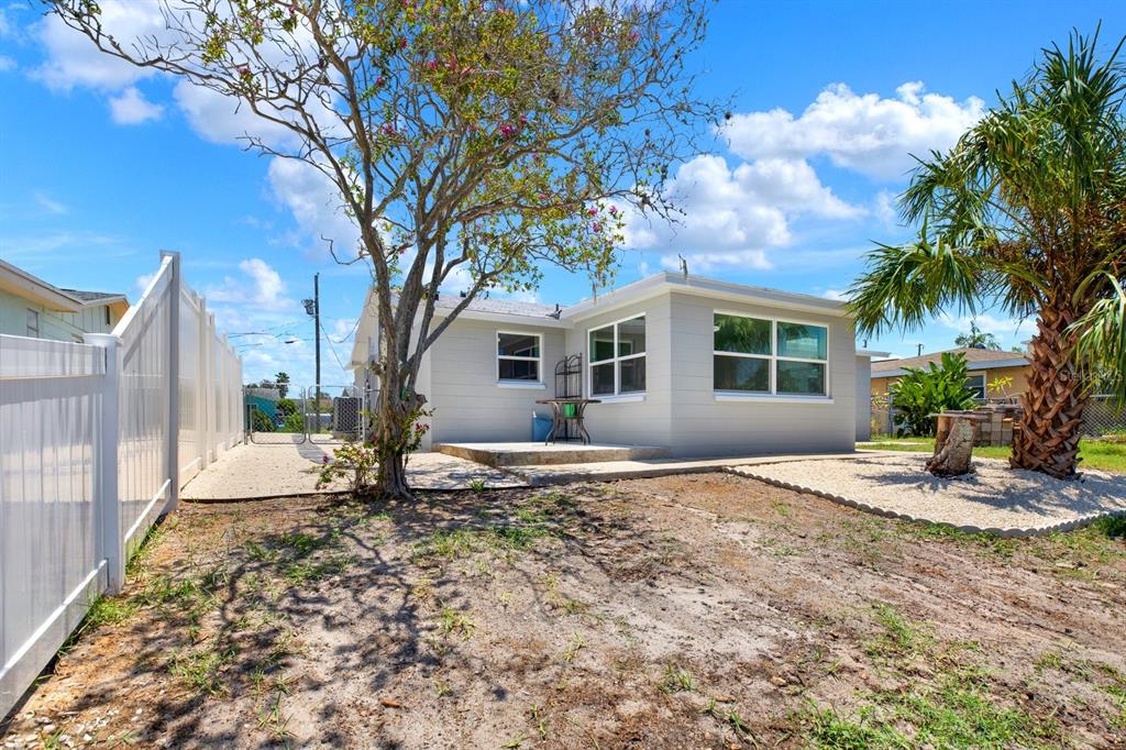 13739 Lavender Avenue Hudson, FL 34667 - Photo 18 of 25 a view of a house with backyard and a tree