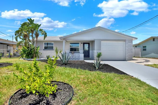 a house view with a garden space